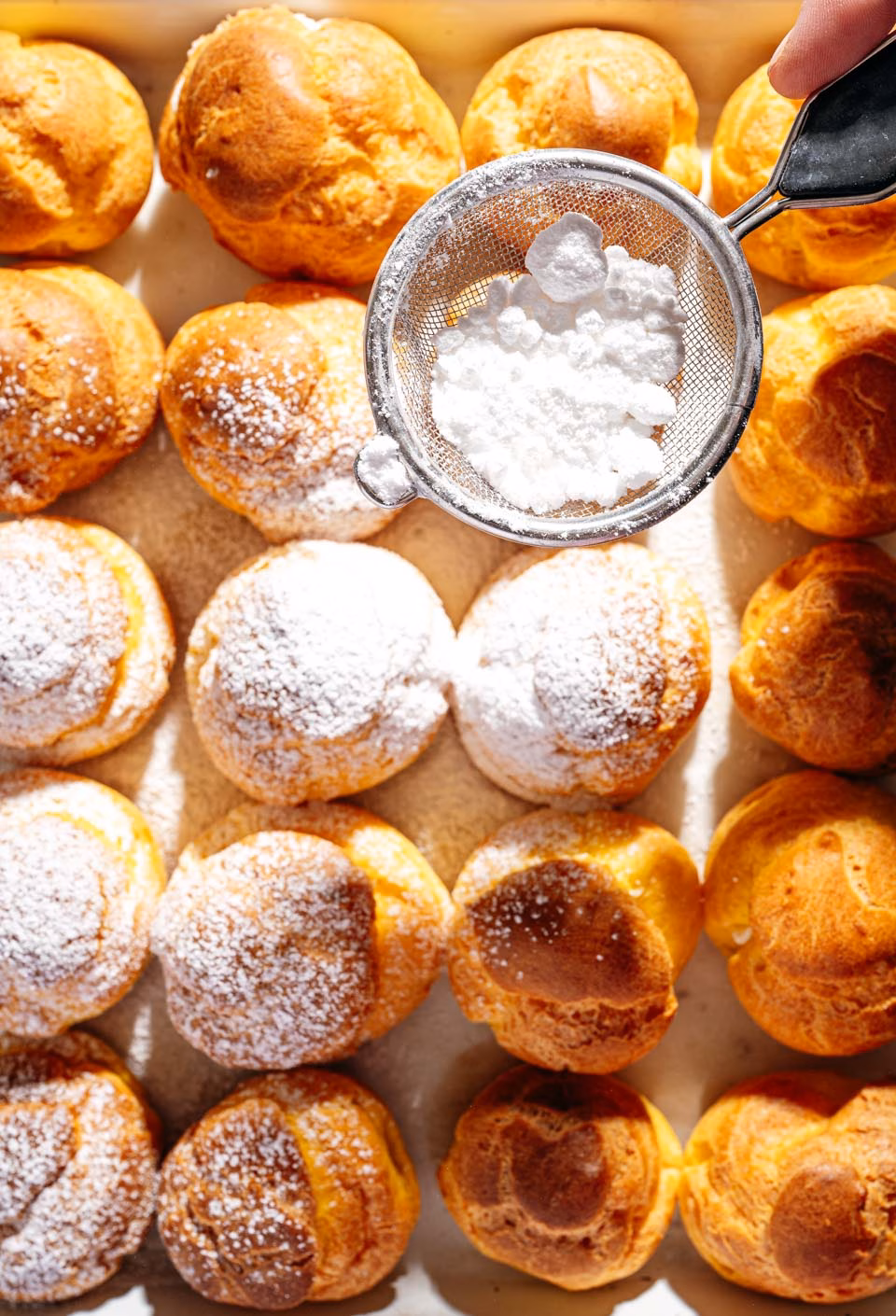Cream puffs with powdered sugar
