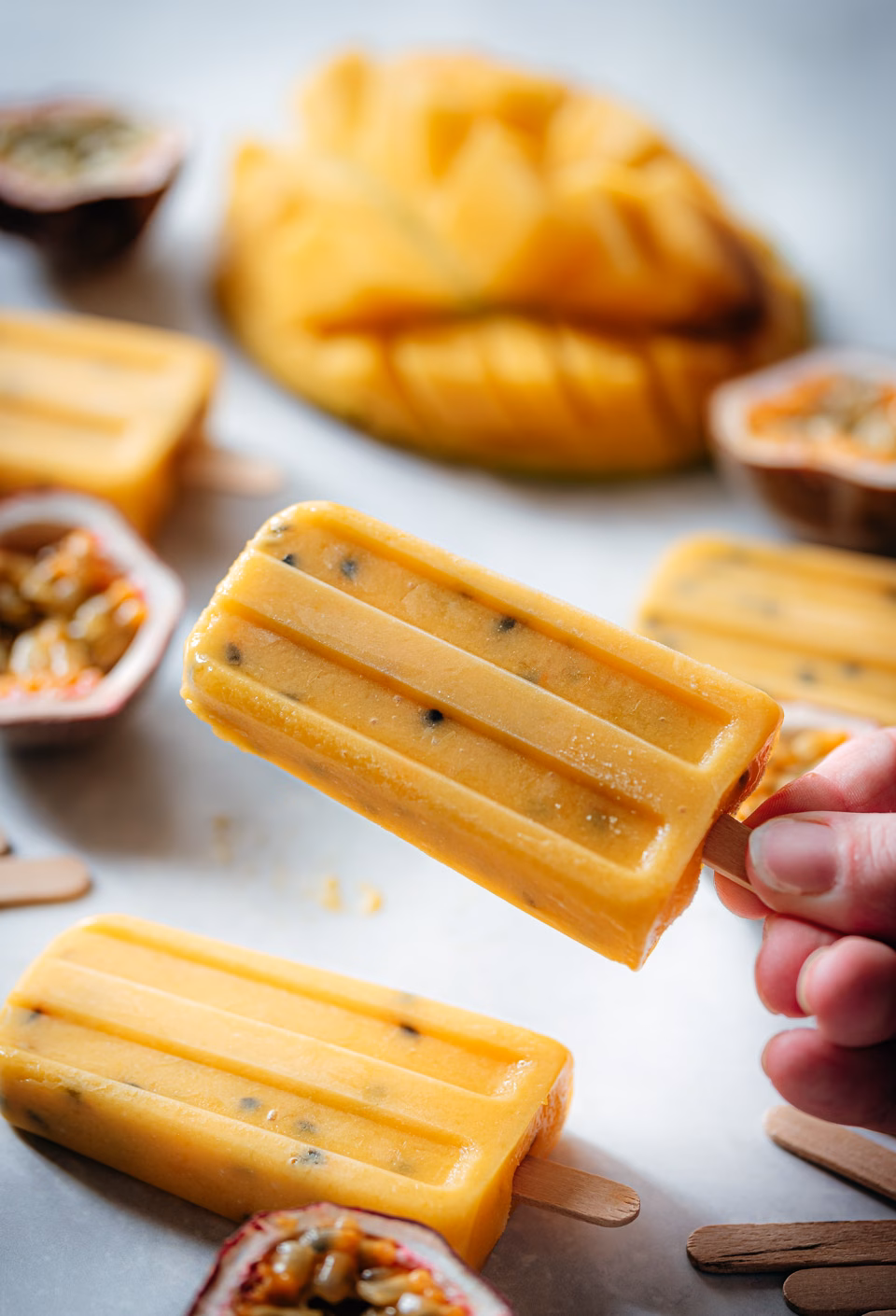 Popsicles with mango and passionfruit