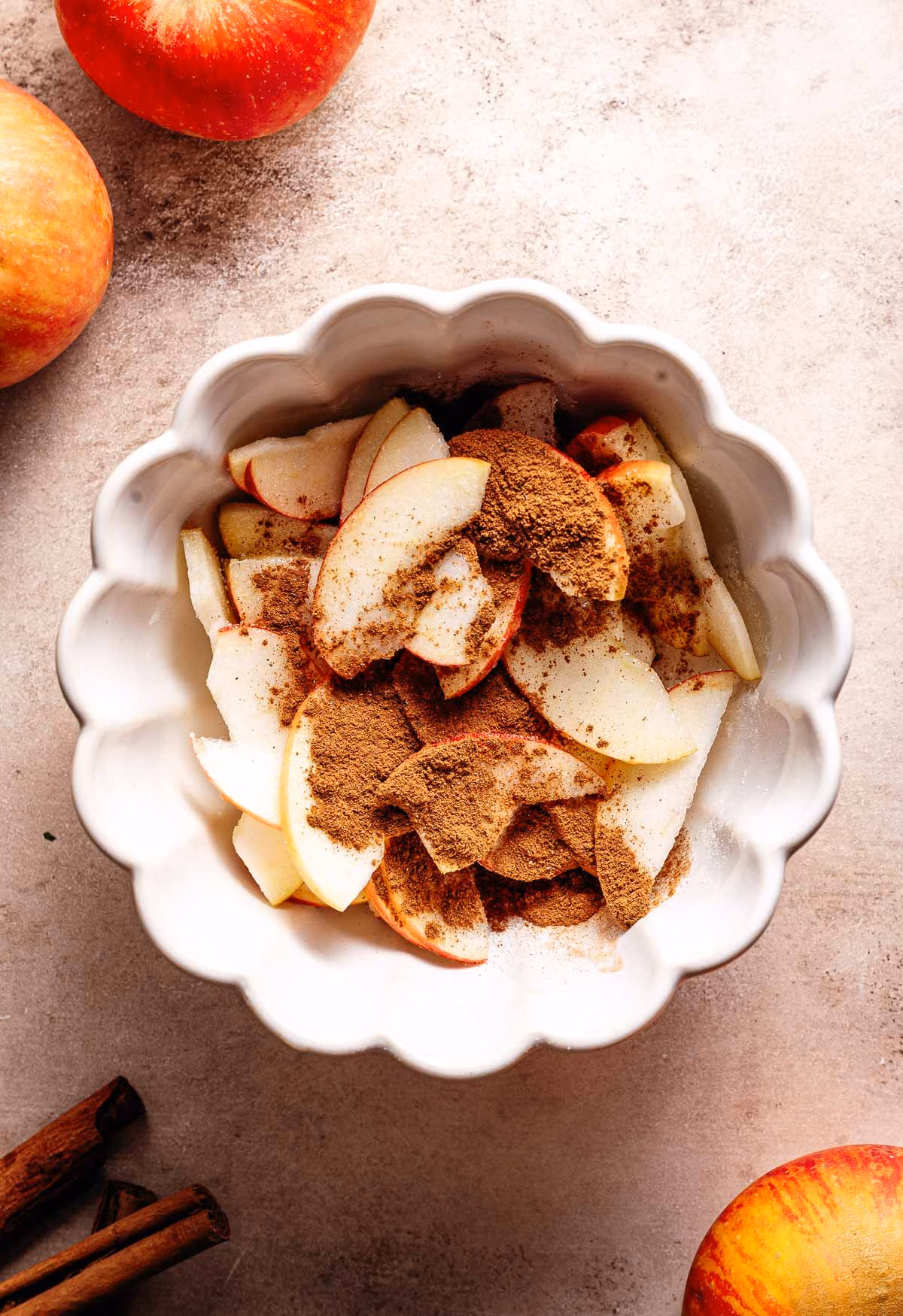 Mixing apples with cinnamon